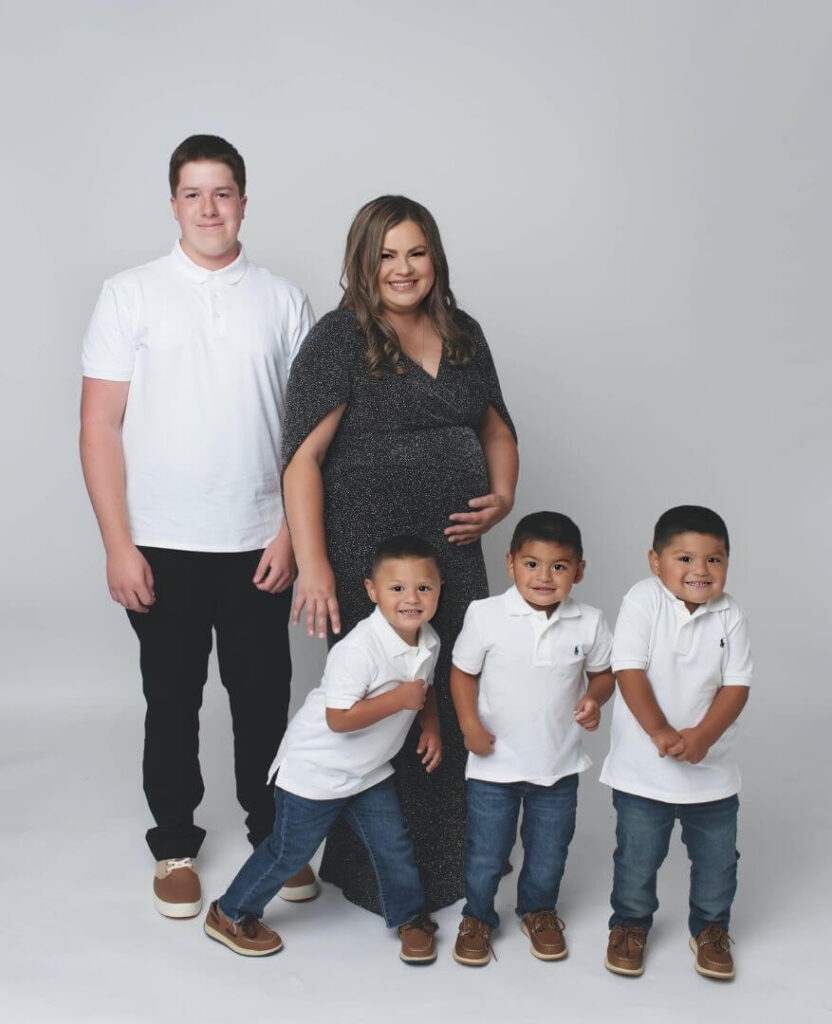pregnant woman from IVF with her 4 adopted sons