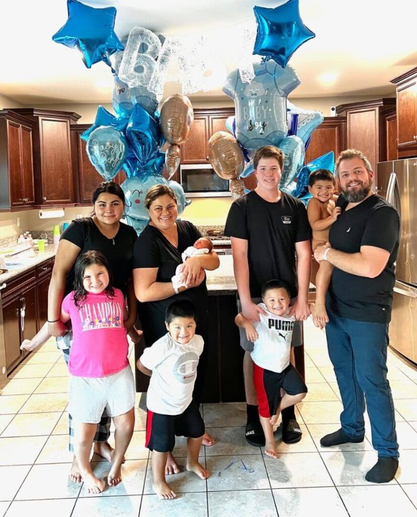 family celebrating the birth of their newborn IVF baby