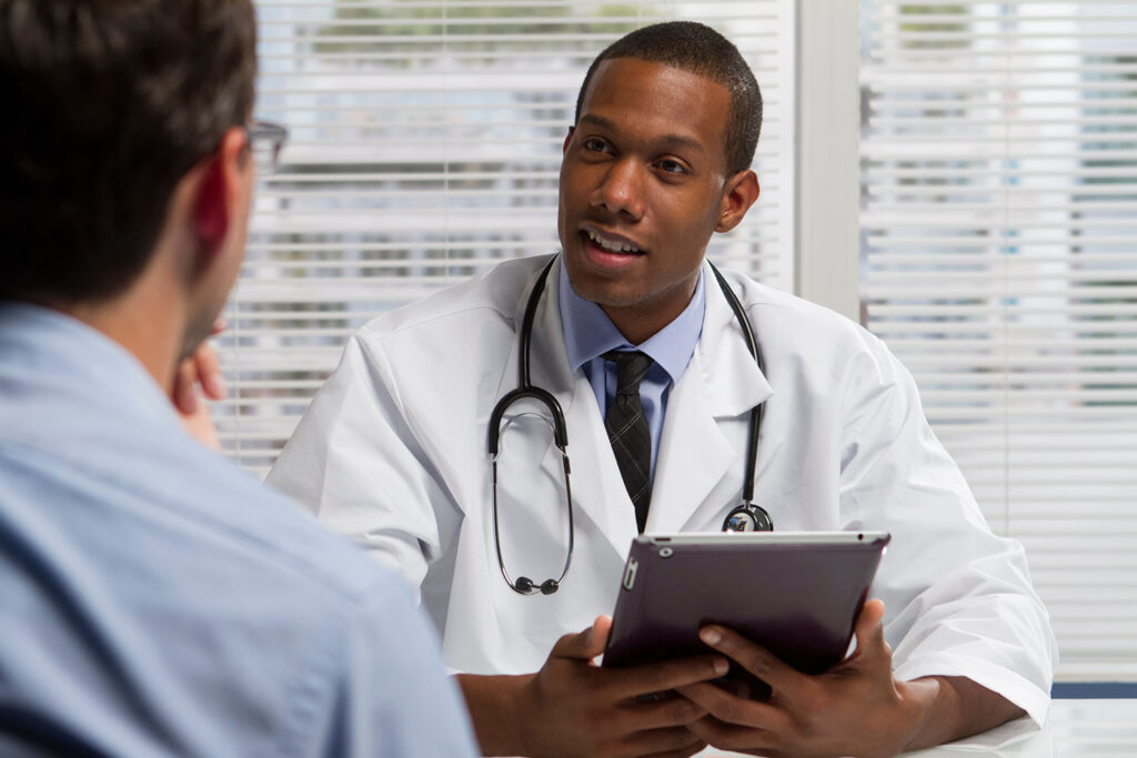 reproductive urologist talking to a male patient