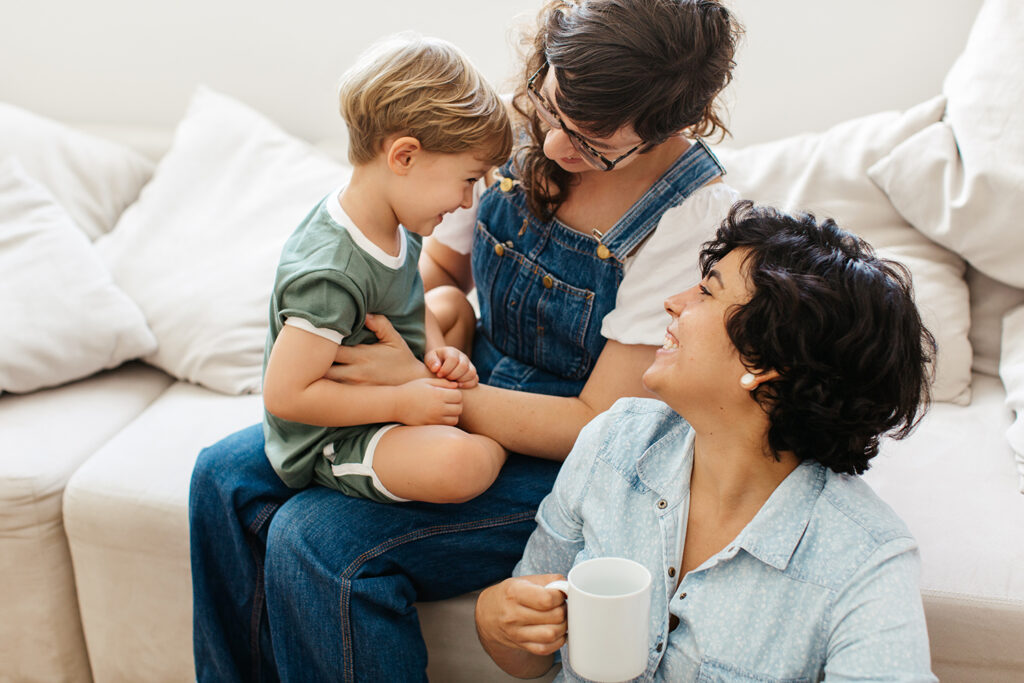 Same-sex female couple spending time with their son at home