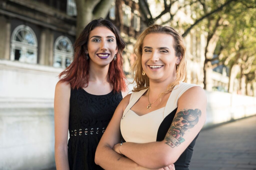 two transgender individuals smiling